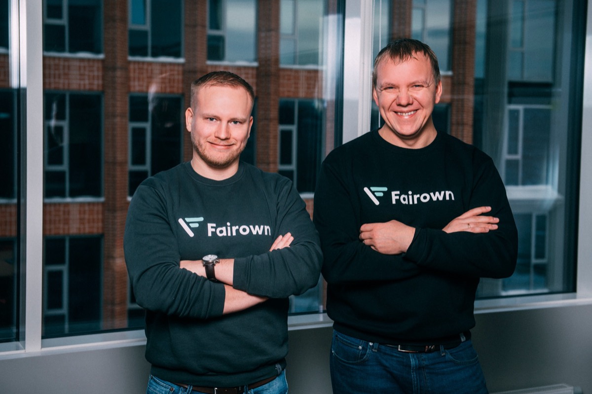 Fairown's co-founders in Fairown sweaters at the office